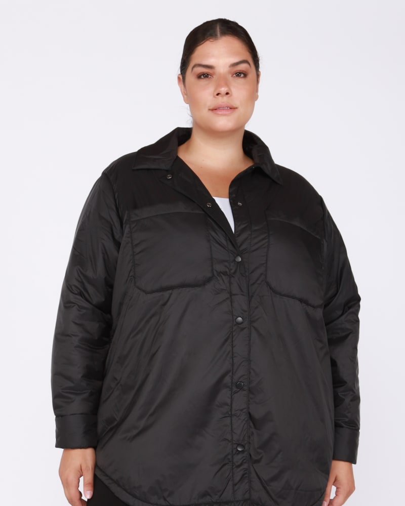 Front of a model wearing a size 0X Leah Snap Front Puffer Jacket in Black by DEX PLUS. | dia_product_style_image_id:237840